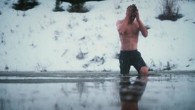 Fit Young Man Cold Plunging In An Icy Pond In Winter