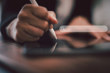 Business Woman using a digital pencil on iPad. hand holds stylus and puts an electronic signature...