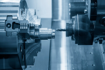 The CNC lathe machine  milling cut the metal shaft parts by milling spindle.