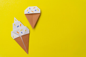 Summer background origami little and big ice cream. Simple diy with kids children's concept.