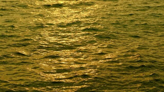 sea water and waves at sunset The magic of tropical waters and paradise beaches in the Andaman Sea.