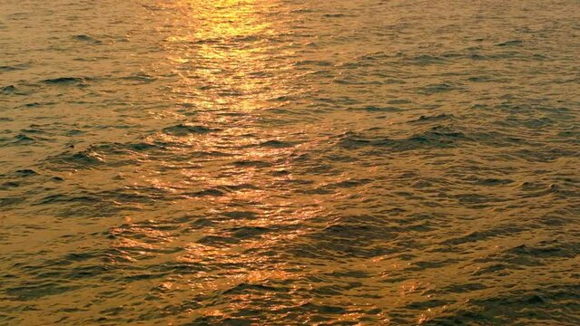 sea water and waves at sunset The magic of tropical waters and paradise beaches in the Andaman Sea.