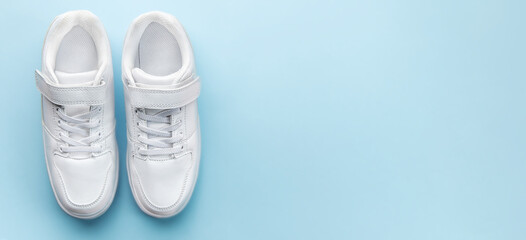 White sneakers on a blue background.