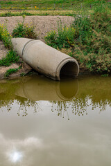 concrete sewer pipe in the river