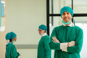 Multidisciplinary teamwork Three doctor portrait in green coat surgical gown with stethoscope...