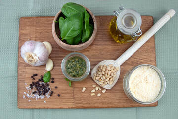 Pesto ingredients, oil, parmesan, pine nuts, garlic, basil