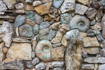 Fragments of a wall with various types of decorative decoration, for street fencing from animals and other purposes, close-up.
