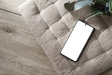 Mobile phone screen mockup, minimalist aesthetic business template with smartphone on beige interior pillow background, copy space