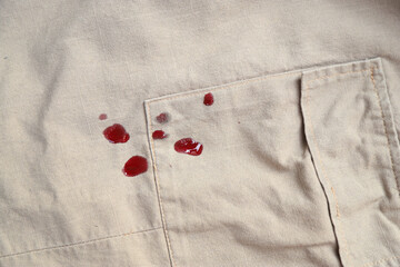 Dirty blood stain splash on cloth fron using sharp knife in cooking. dirty stain for cleaning...