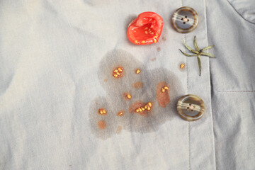 Tomato stain on clothes from eating in daily meal. dirty stain for cleaning concept idea