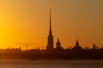 Naklejka premium Cityscape of St. Petersburg with sunset and fortress