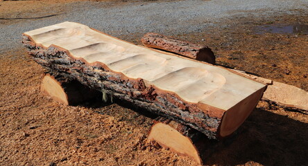a bench made from a tree stump