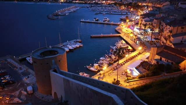 Illuminated evening cityscape of Calvi port. Fabulous summer scene of Corsica island, France, Europe. Incredible seascape of Mediterranean sea. Full HD video (High Definition)..