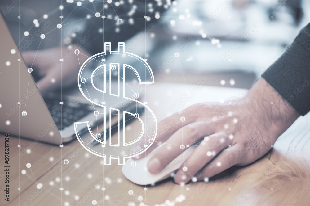 Poster close up of businessman hands using laptop at desktop with glowing dollar sign inside polygonal sphe