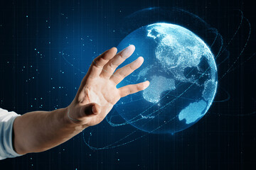 Close up of male hand using glowing blue polygonal globe on blurry background. Global technology...