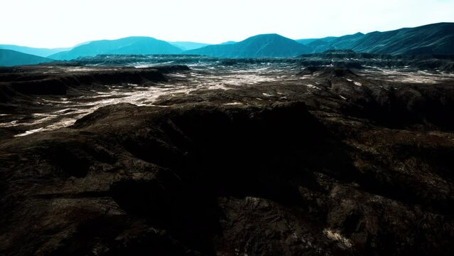black volcanic basalt rock formations in the low light