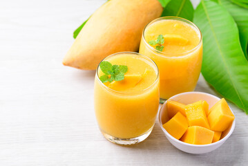 Fresh mango smoothie in glass, Cold drink in summer season