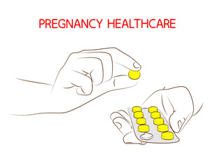 Pregnancy healthcare. Taking pills or prenatal vitamins during pregnancy. Female hand holds tablets in blister pack, close-up. Medical, treatment and healthcare concept. Pharmacy help, medicine drug