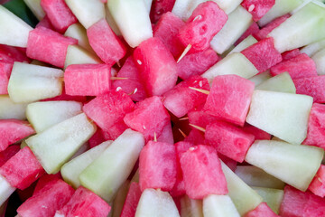 Mixed peeled watermelon and melon for dessert at a party