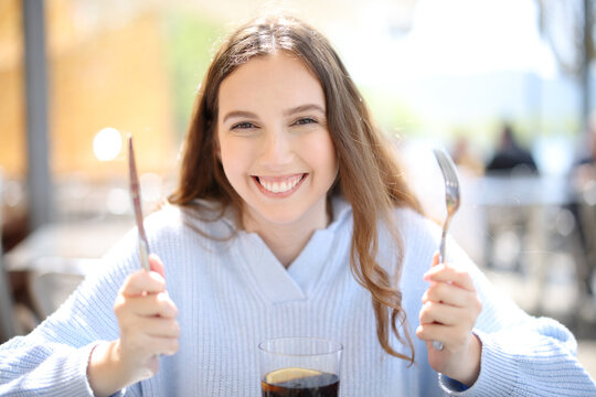 Happy restaurant customer ready to eat