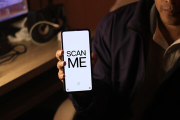 Hand touching smart phone login application system to scan qr code for business financial transaction and new modern technology