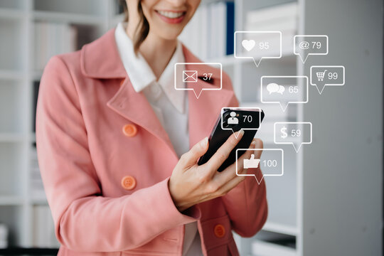 Social media and Marketing virtual icons screen concept. close up of businesswoman typing keyboard tablet with laptop computer  and smart phone.