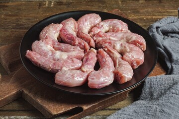 Raw food chicken neck uncooked on a plate