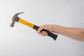 Hand with hammer on white background.