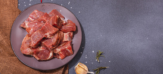 Raw pork loin pieces with ground spices. Marinated meat cuts, ingredient for cooking healthy food