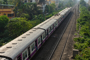 9th April, 2023, Kolkata, West Bengal, India: A local electric train on railway track of local...