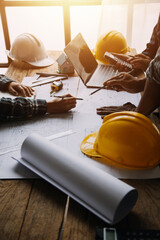 Construction and structure concept of Engineer or architect meeting for project working with partner and engineering tools on model building and blueprint in working site, contract for both companies.