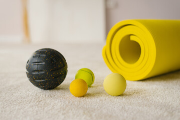 Balls, hand and foot massage for myofascial relaxation, yoga mat. Equipment for MFR. Self-massage tools - Powered by Adobe