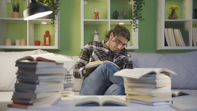 Tired and sleepy college student young man.