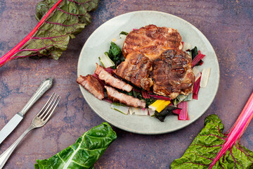 Meat steak with green salad.