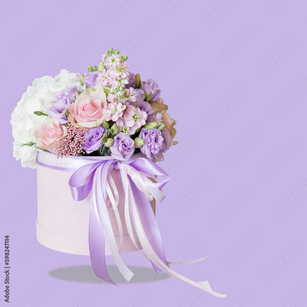 Sticker Floral concept. White, pink and purple flowers in a bouquet. Different flower on bouquet in a cylindrical box, levitation. Gentle lilac background. Birthday, Mother's Day banner. Copy space. Mockup.