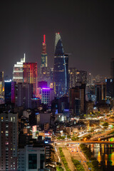 Fototapeta na wymiar Ho Chi Minh city, Vietnam Apr 2023 Aerial night view of Ho Chi Minh city skyline look from a roof top of Gold view Apartment