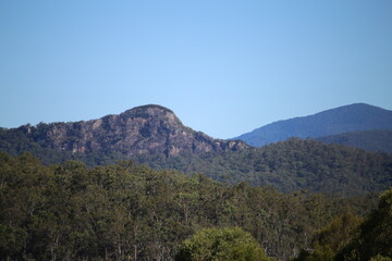 Rocky Cliff and Green Tree Hill