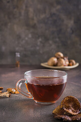 Organic mushroom tea in a cup for alternative herbal medicine vertical view