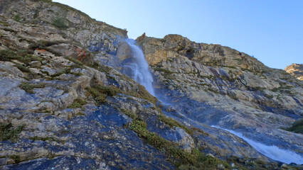 Fototapeta na wymiar cute mountain high land fast water fall at summertime day - photo of nature