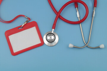 Accreditation for medical events. Red stethoscope with blank red badge with string.