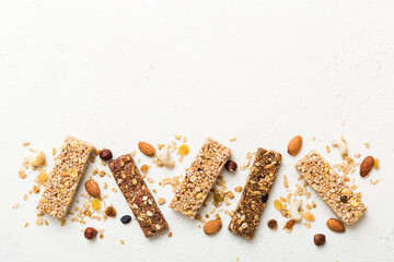 Various granola bars on table background. Cereal granola bars. Superfood breakfast bars with oats,...