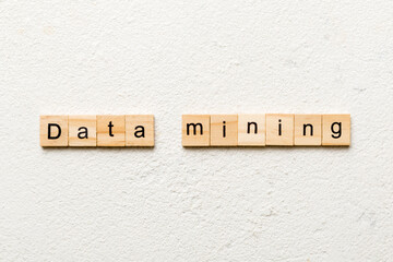 Data mining word written on wood block. Data mining text on cement table for your desing, concept