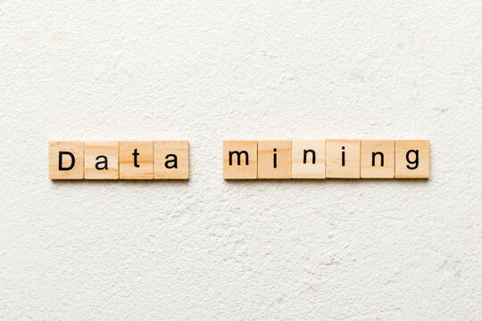 Data mining word written on wood block. Data mining text on cement table for your desing, concept