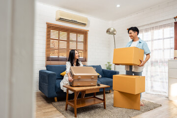 Asian young happy new marriage couple moving to new house together. 