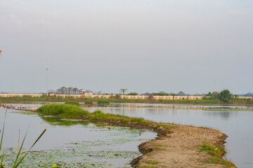 Beautiful sunrise at wet land near Kolkata.Selective focus on grass and small path..
