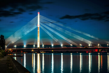 Suspension bridge in Riga at night - obrazy, fototapety, plakaty