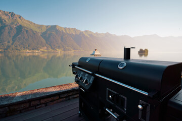 Grill stove equipment on the patio with beautiful lake view.