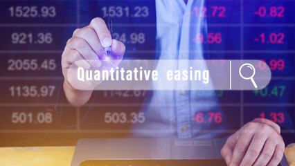 Fototapeta na wymiar Quantitative easing written in search bar with the financial data visible on background, Quantitative easing concept stock Market online marketing
