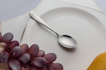 Stainless steel tableware and kitchen utensils placed on the desktop