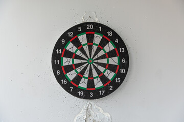 darts on the wall in a hole from darts